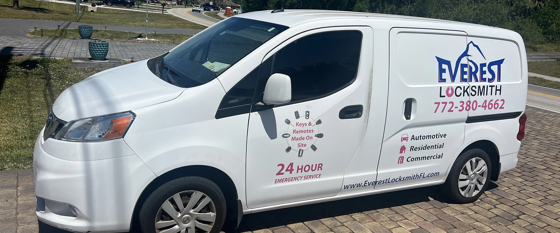 everest white van is parked on the side of the road