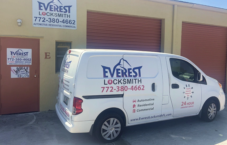 everest white van is stationary outside a building