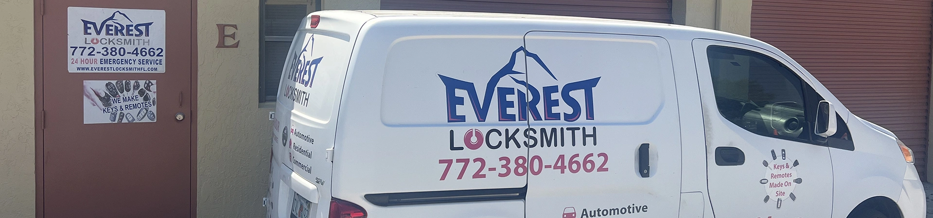 everest white van parked outside a building